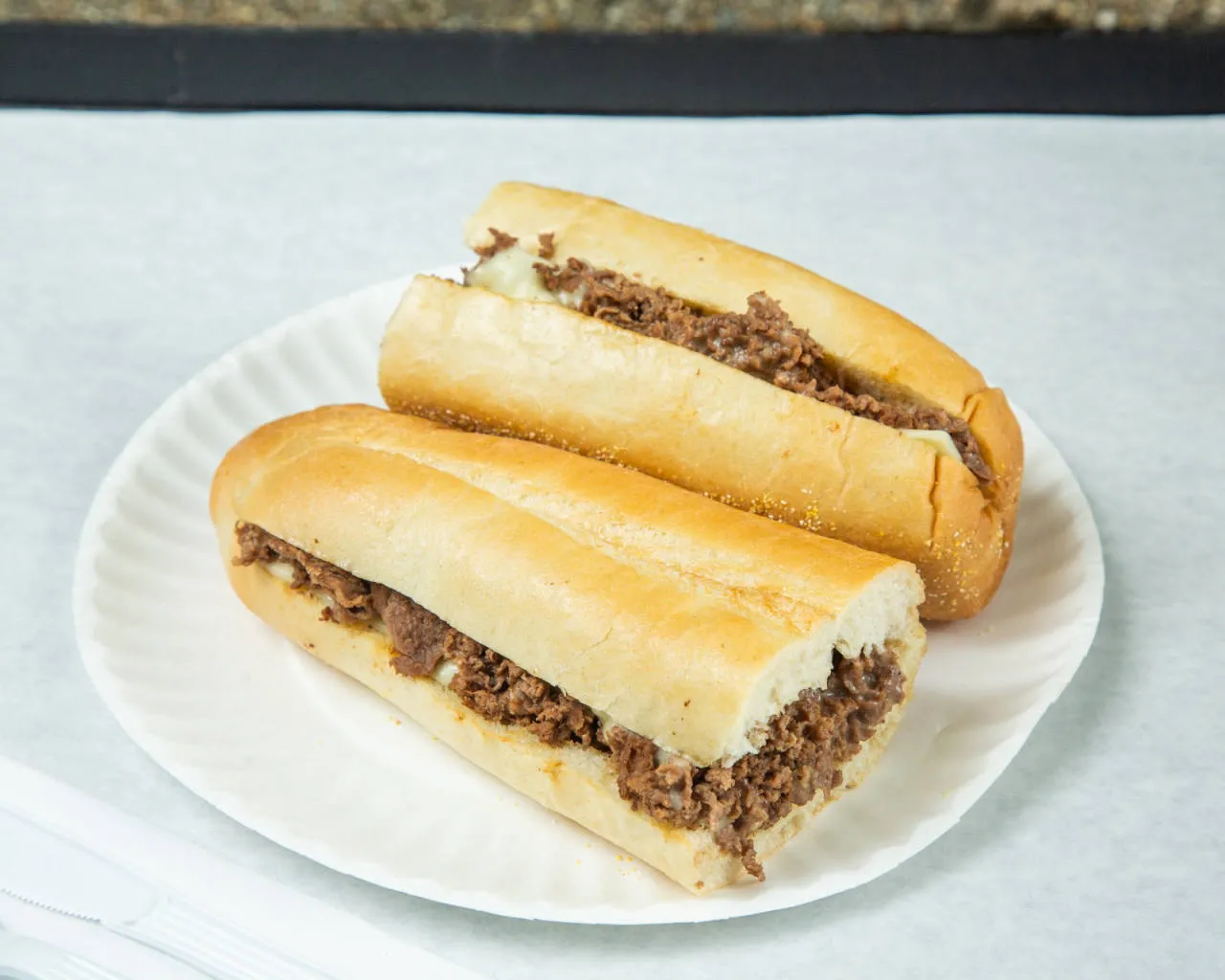 Ashmont Market steak and cheese sub on a fresh roll with white American cheese